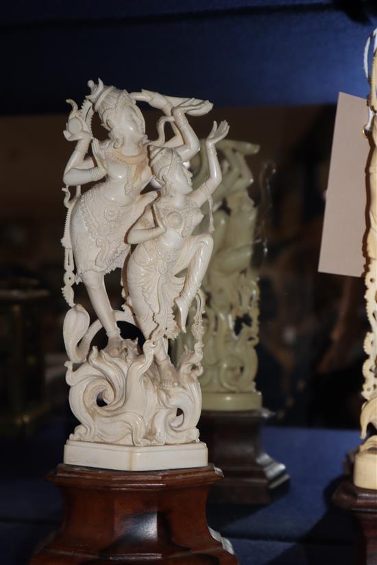 Three Indian ivory carvings on wooden bases Tallest 27cm